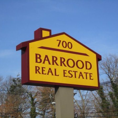 The yellow and maroon Barrood Real Estate sign at 700 Easton Avenue