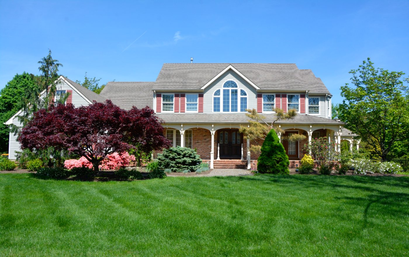 Two-story colonial at 4 Jimmy Court with a wide green lawn